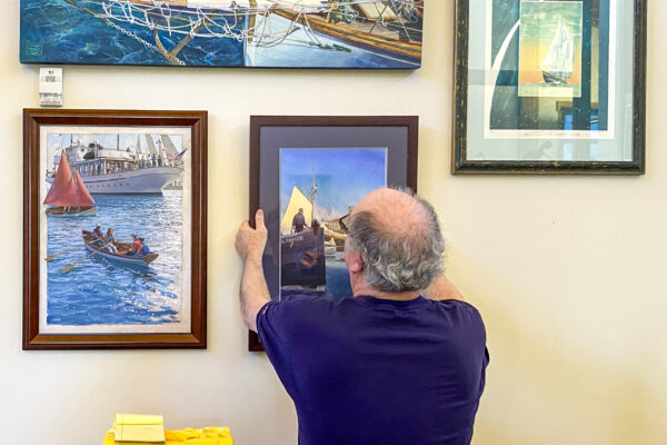 Volunteer Carl Berger hung a wonderful display of maritime artwork in the administrative offices.